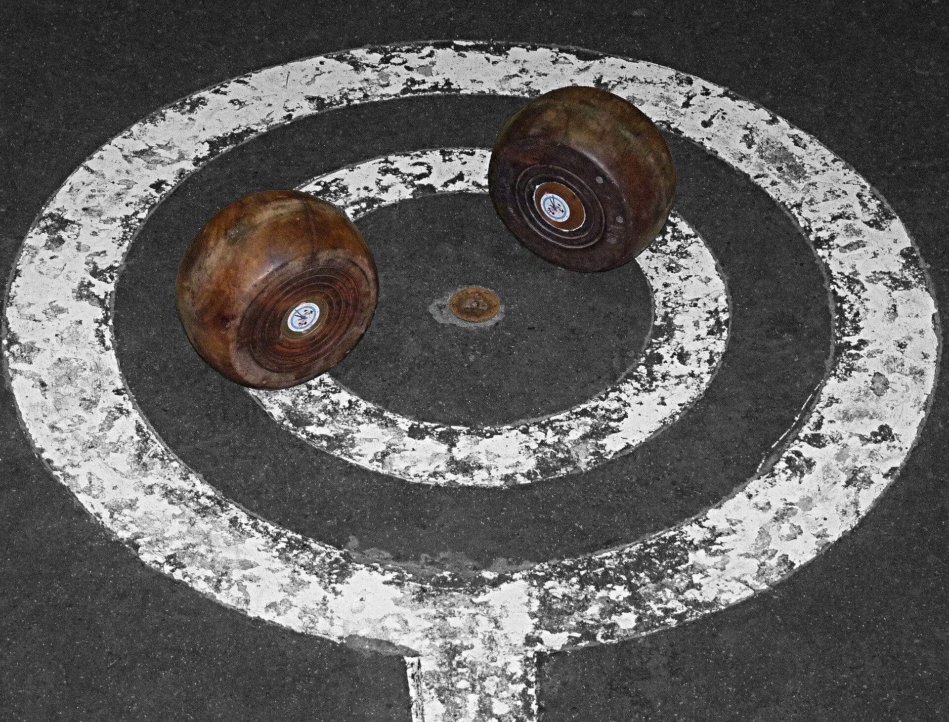 A finished turned bowl held by its foot