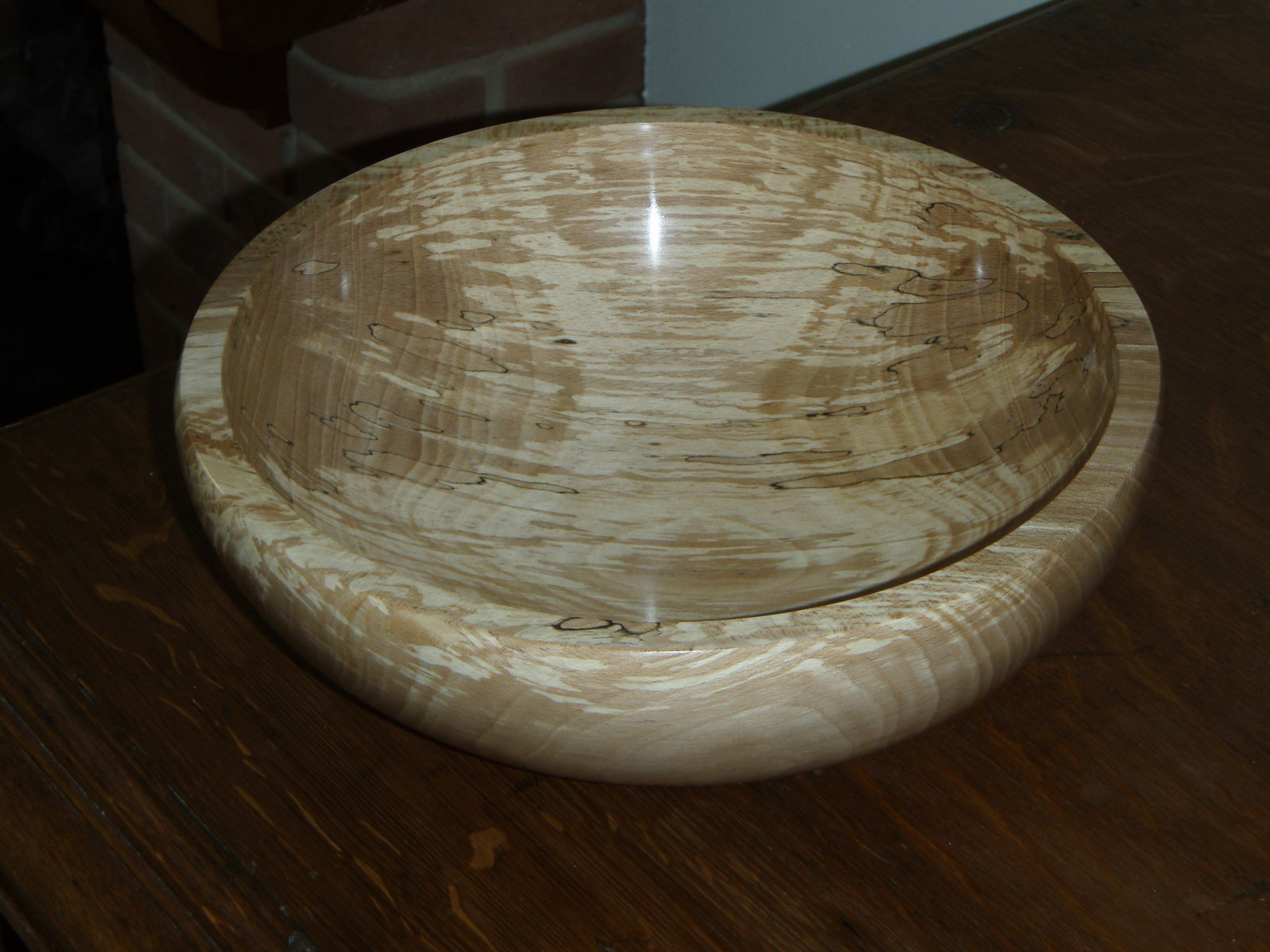 A spalted beech bowl with dark fungal lines