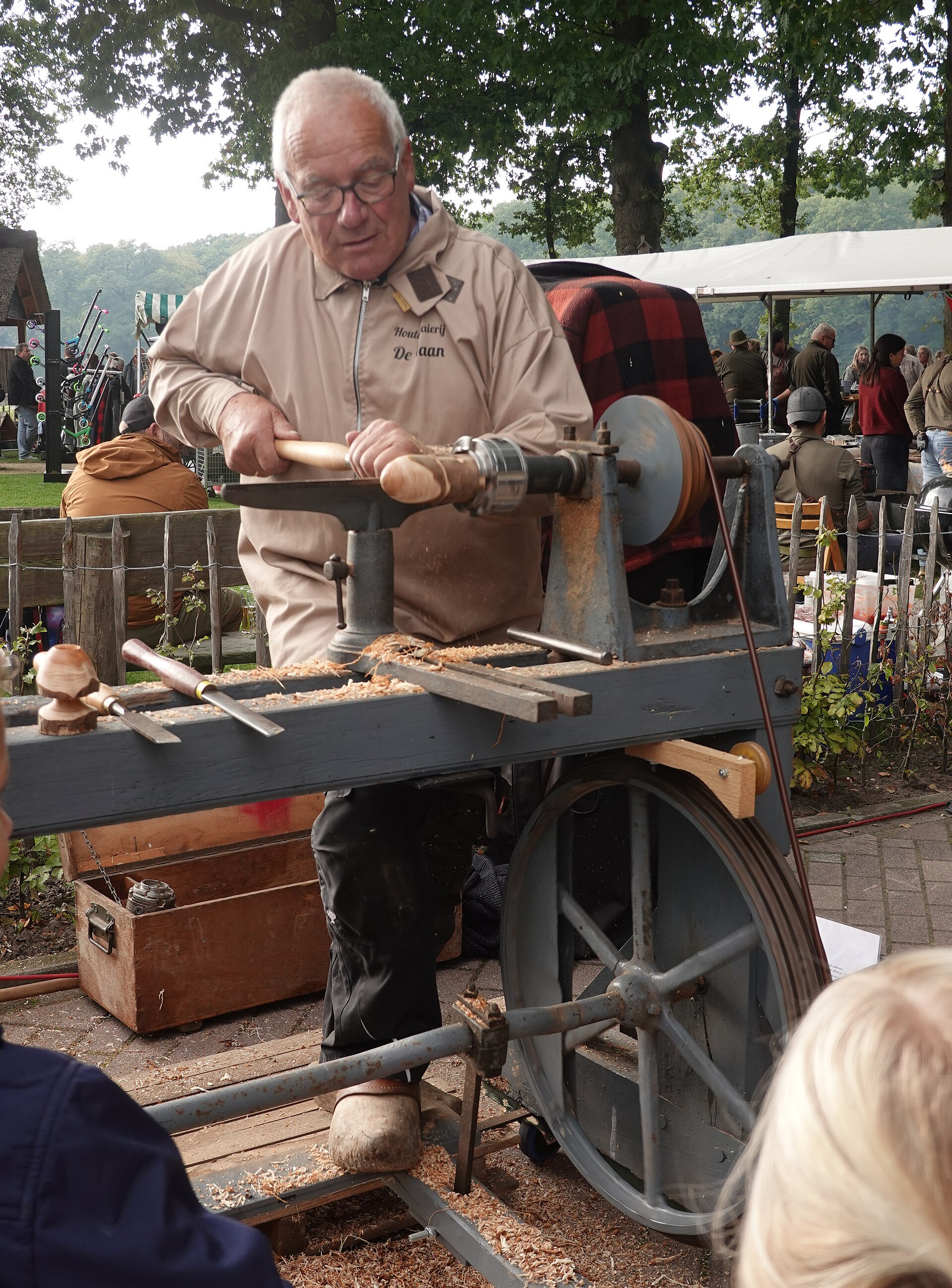 A woodturner taking a cut at the lathe