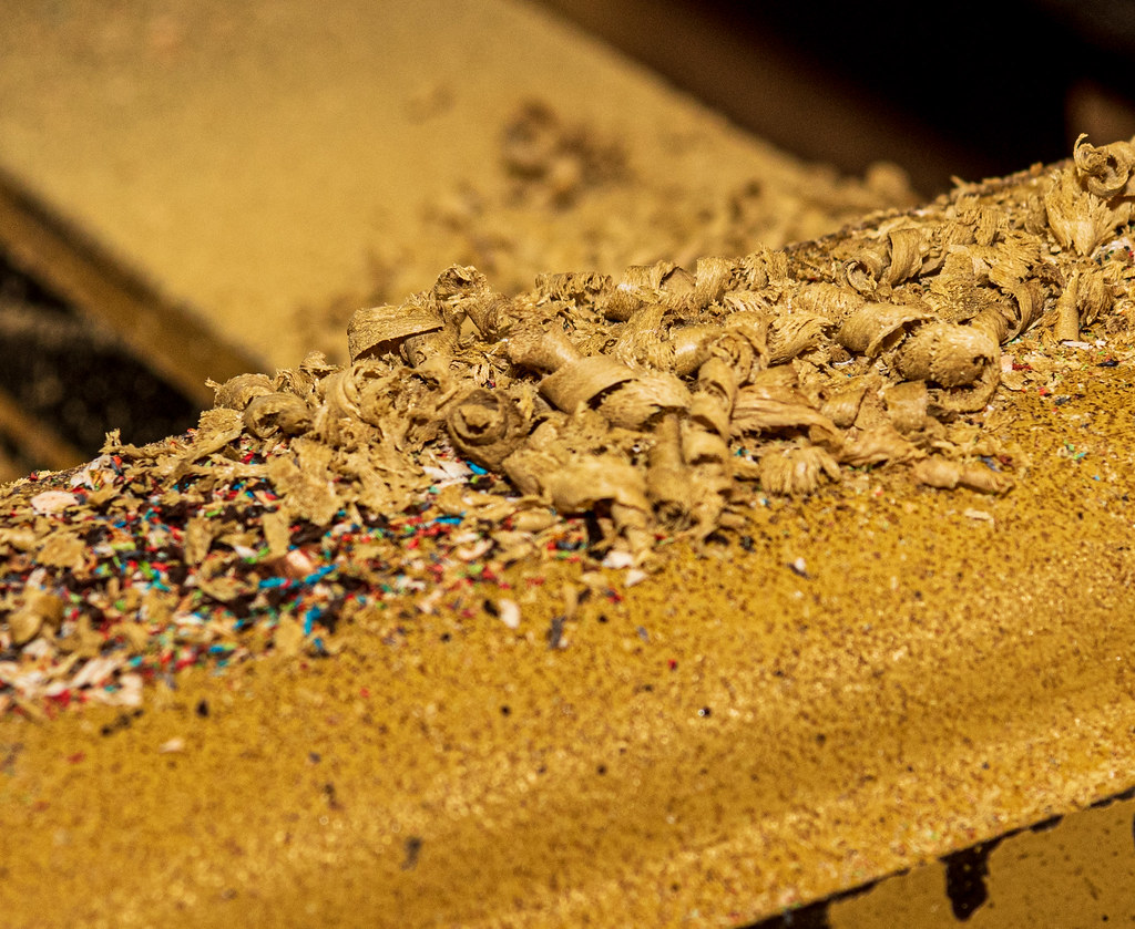 Wood shavings on the floor of a turning shop, evidence of a recent session at the lathe