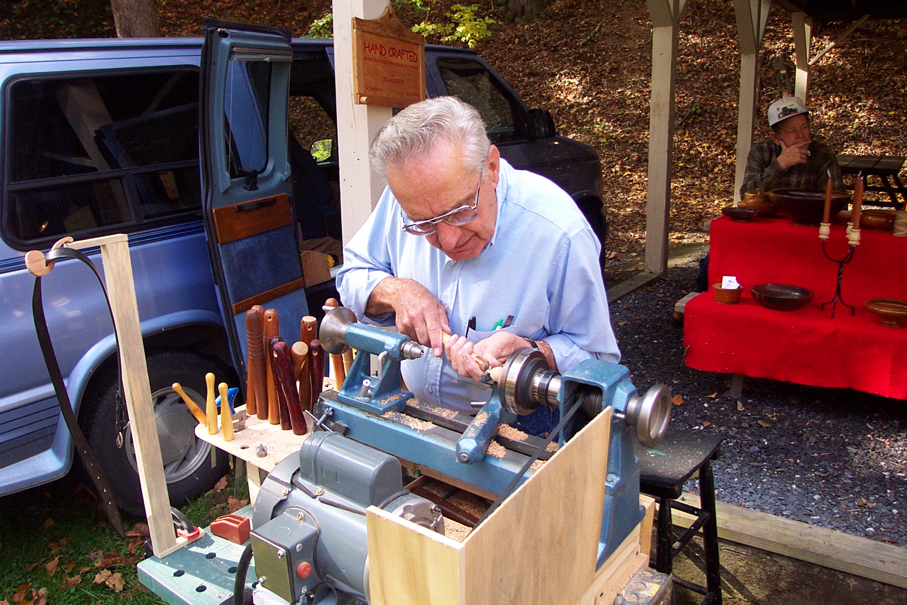 A woodturning demonstration at a lathe
