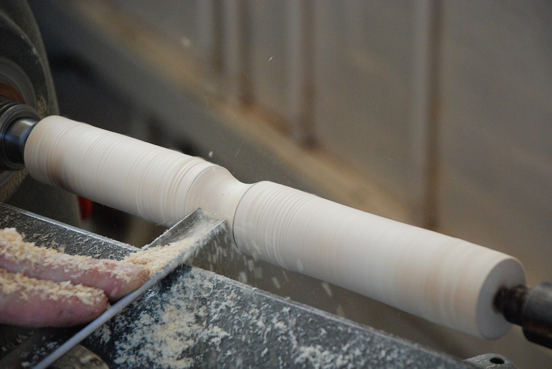 Three-stage demonstration of preparing a wooden blank for turning between centres on a wood lathe